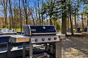 Grill dinner out here under the string lights, then carry your plate over to the fire pit chairs on the golf lawn.