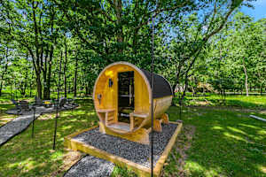 A private cedar barrel sauna right in your backyard — one of the most sought-after wellness amenities in Pocono vacation rentals, and it's all yours for the stay.