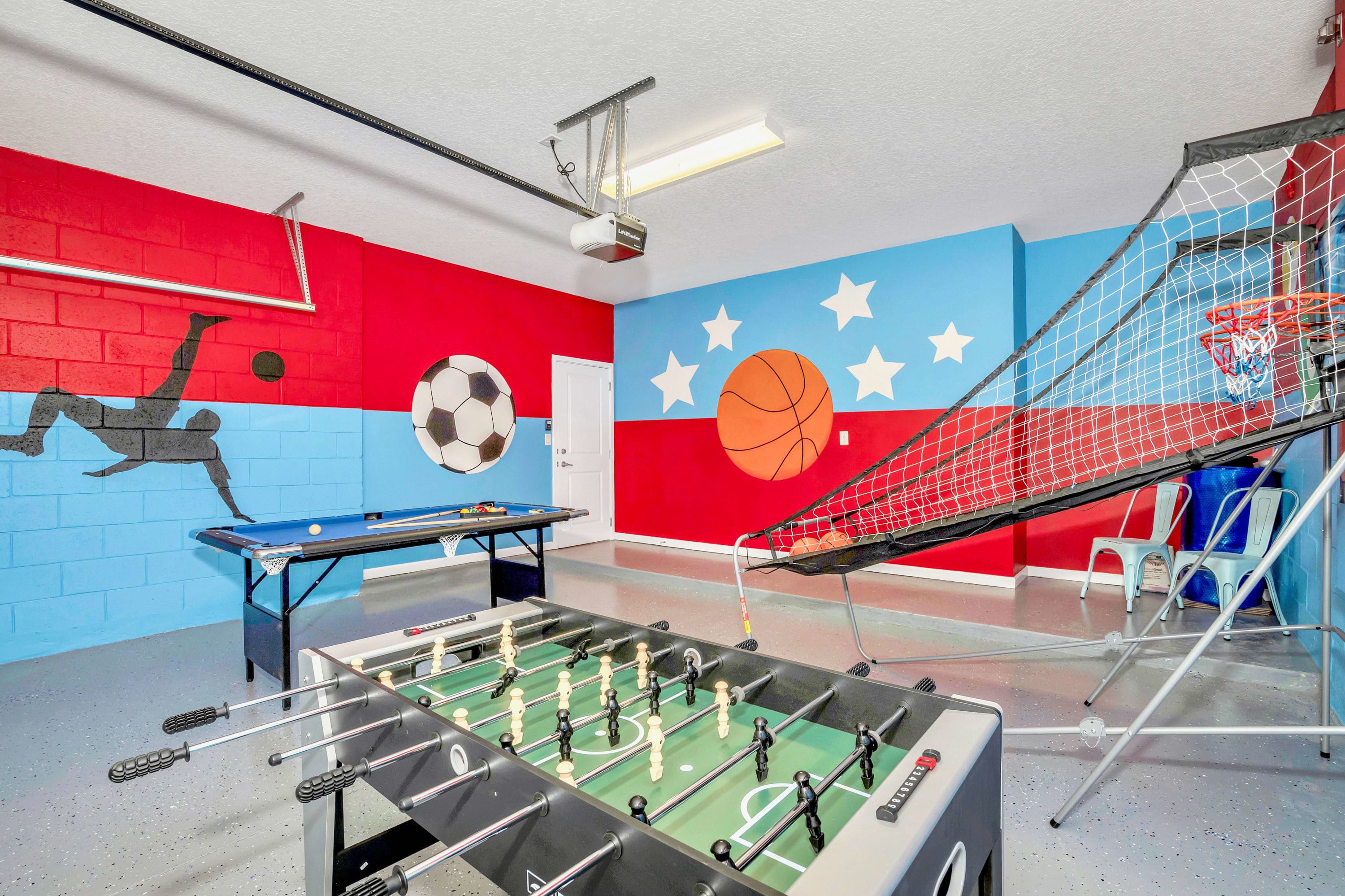 A private sports-themed game room equipped with foosball and basketball