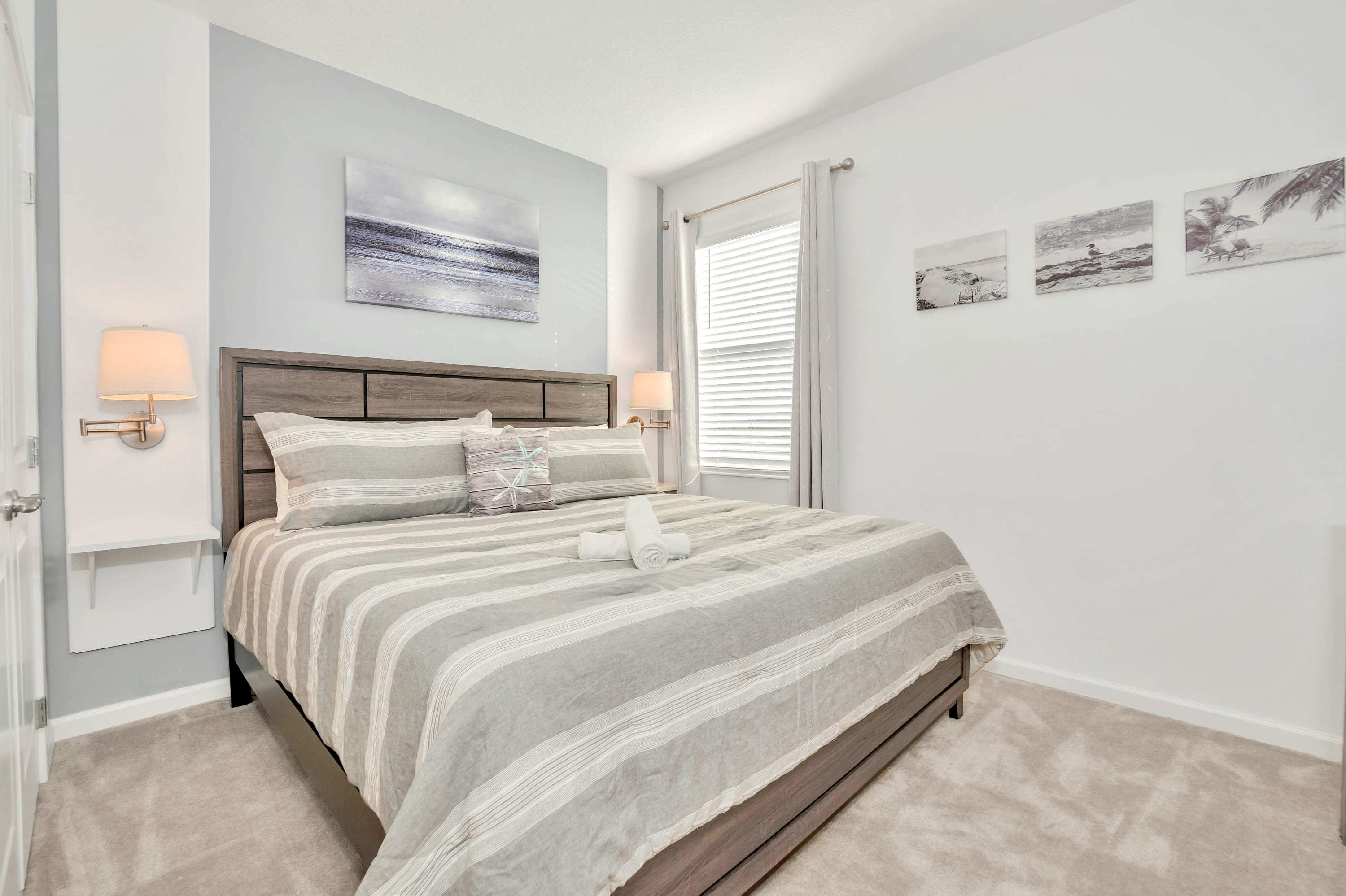 A serene sleeping sanctuary equipped with bedside lamps and neutral decor