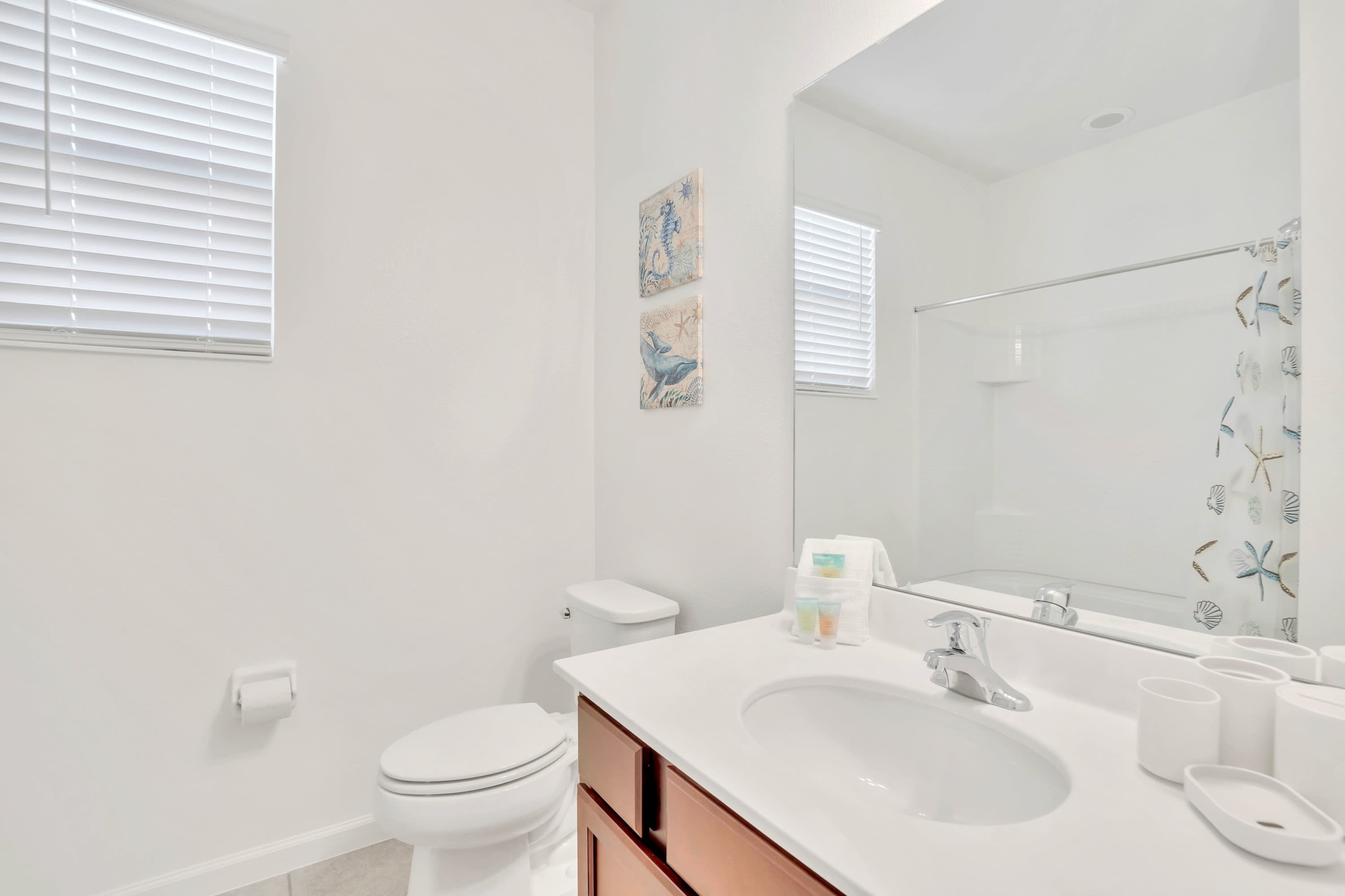 Modern bathroom setup featuring updated fixtures and generous counter space