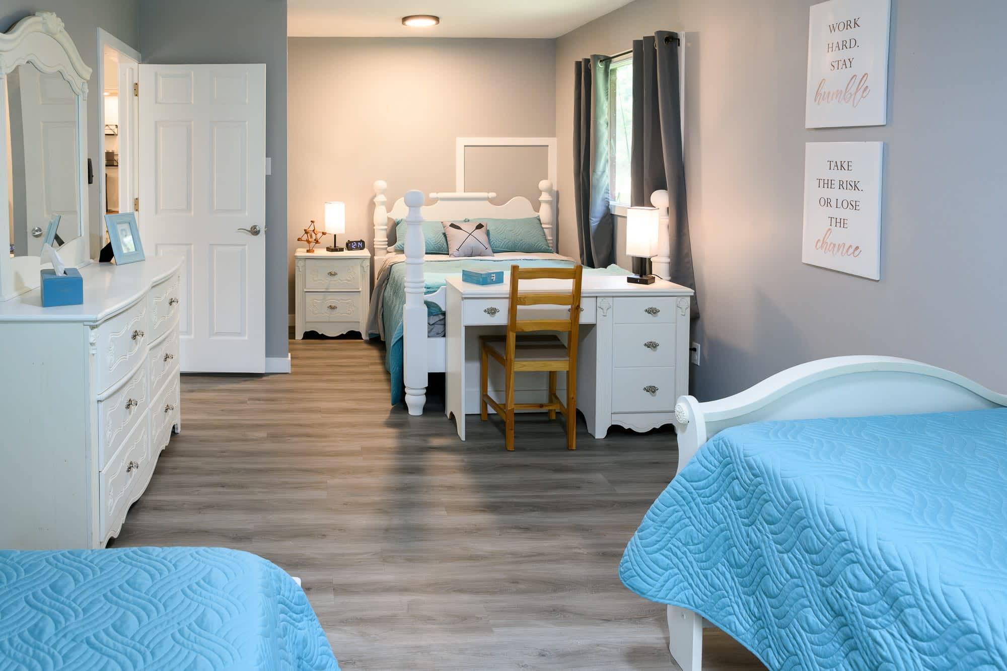 Spacious Bedroom With Twin And Queen Beds Plus A Charming Workstation