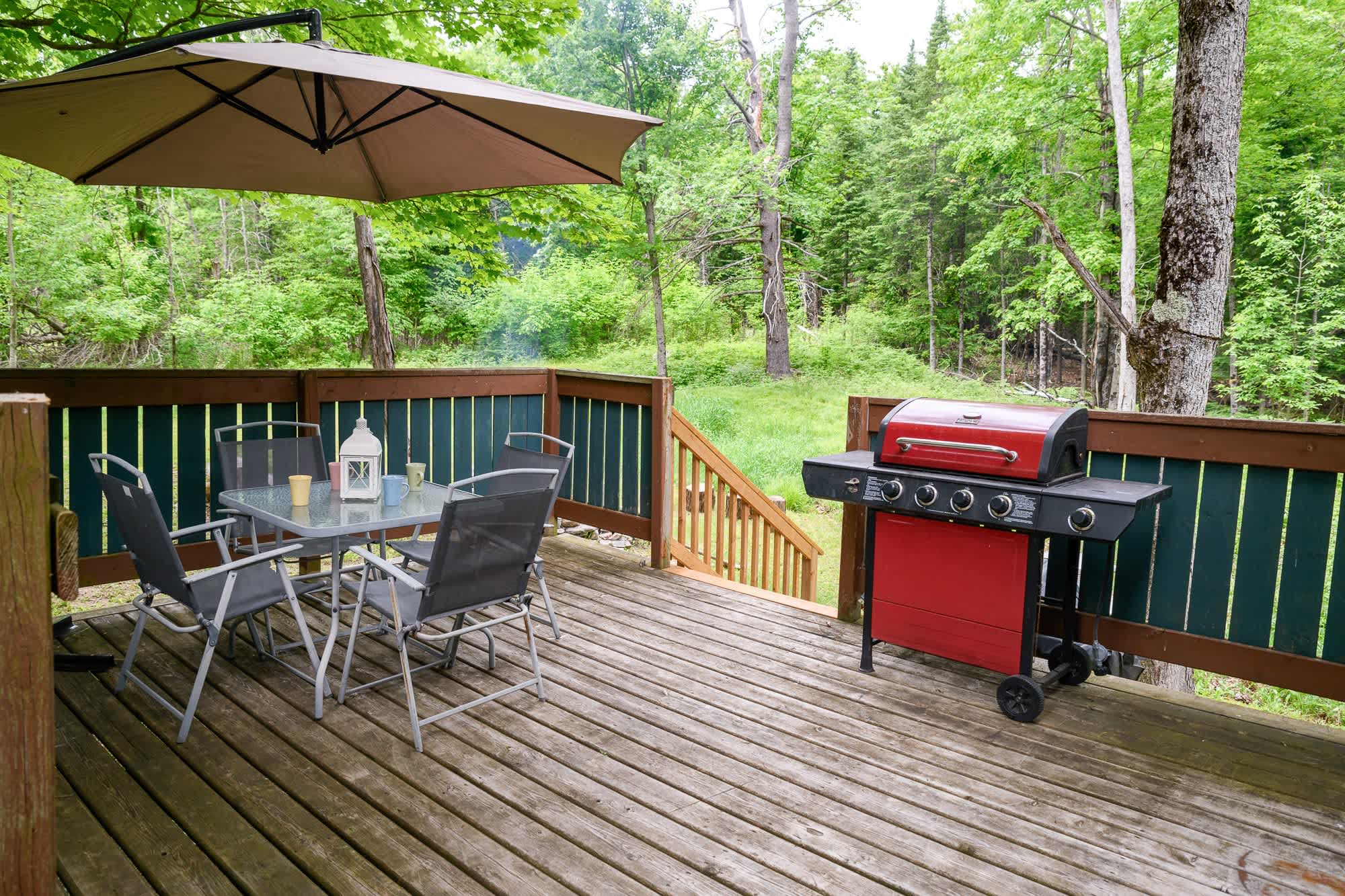 Back patio with BBQ grill and outdoor dining area
