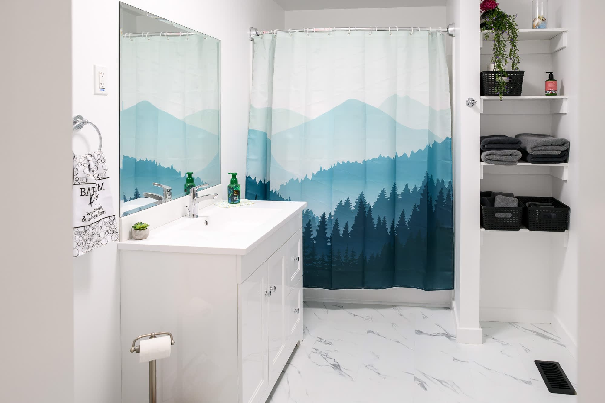 Beautifully Designed Bathroom Featuring A Mountain-Theme Shower Curtain