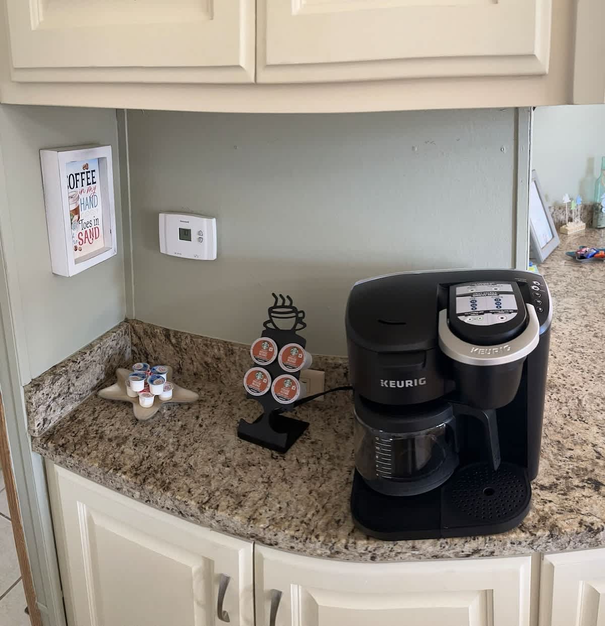 A convenient coffee station with a Keurig coffee machine and mugs to start your day right.

