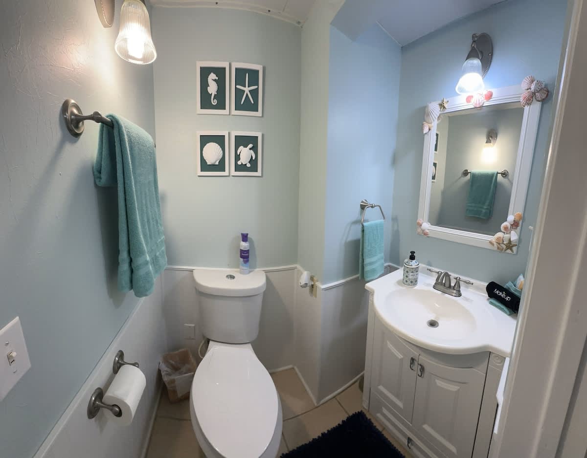 Half bathroom with a toilet and vanity.