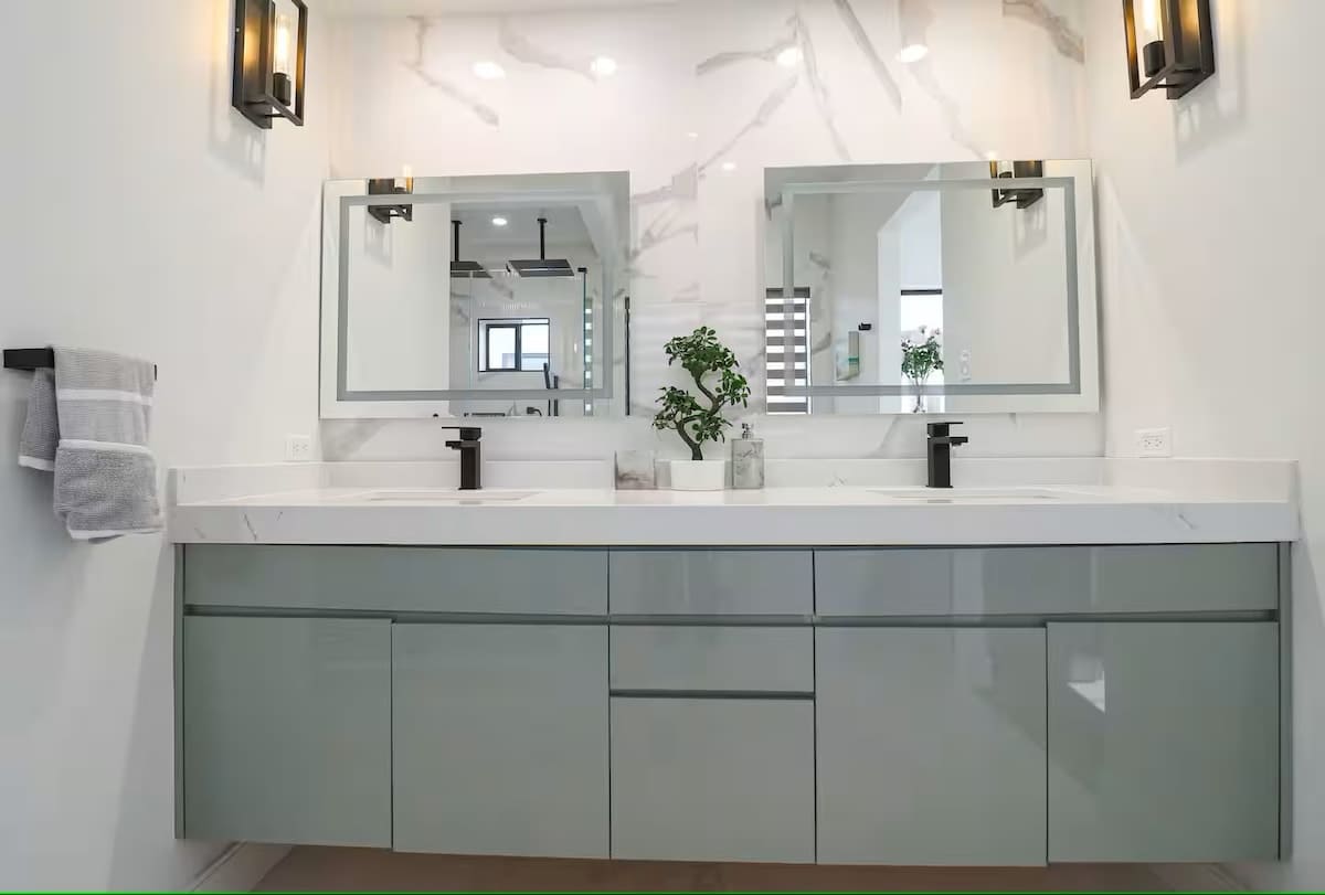 Custom Mirrors and custom countertops in Master Bathroom. The bathroom includes bidet, dual sinks and large walkin closet.