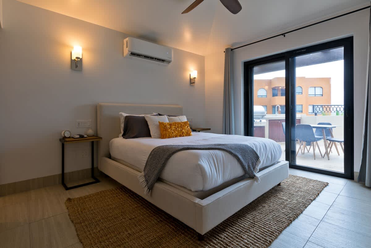 Upper Suite - Bedroom 1 (Queen Bed) with Ensuite Bathroom and access to Balcony