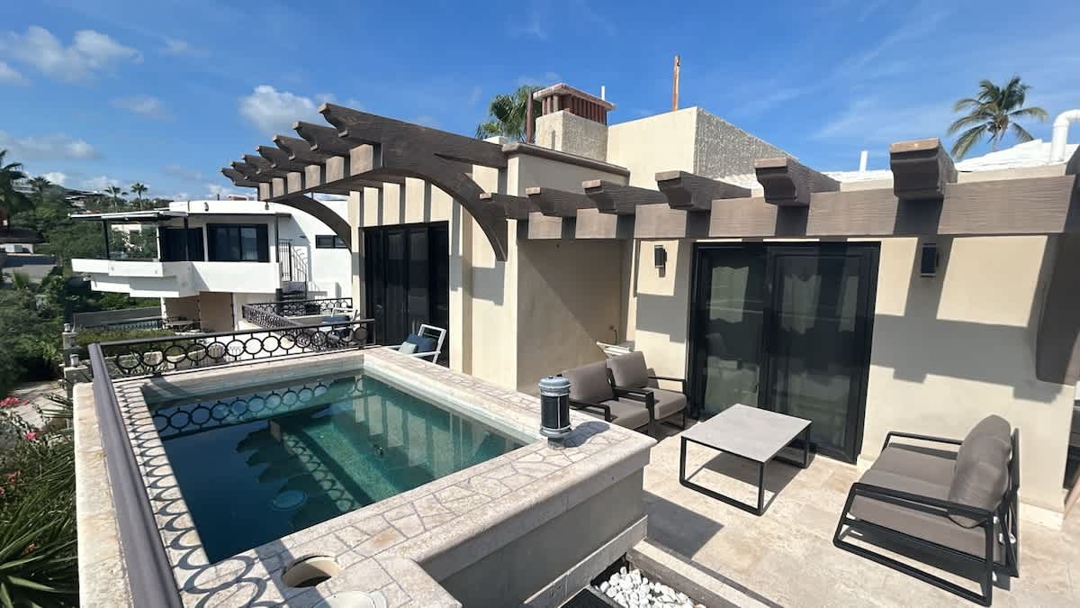 2nd floor deck with hot tub with a view of Los Arcos and Medano Beach