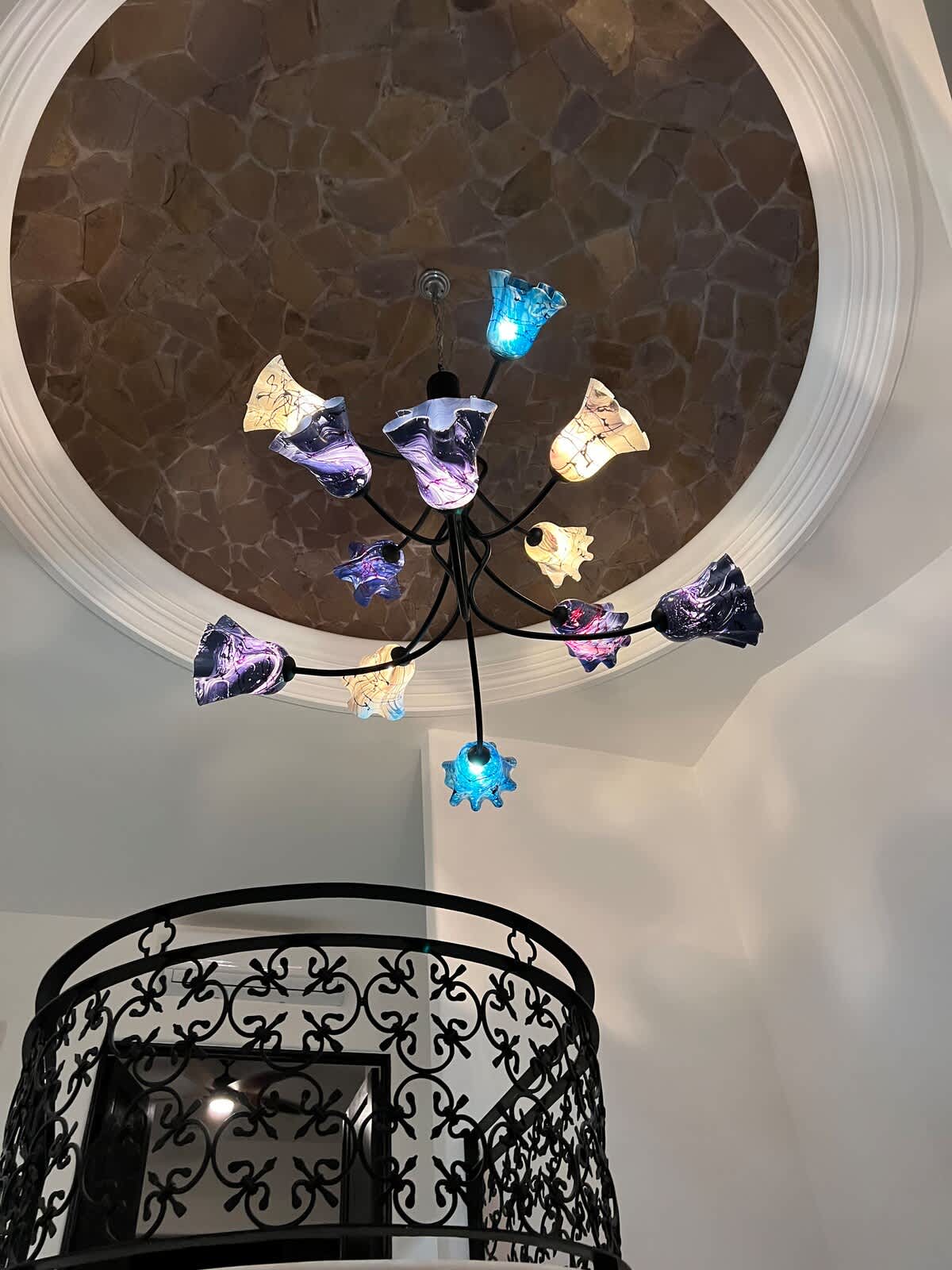 hand blown mexican glass chandelier. A beautiful art instalment that illuminates the foyer.