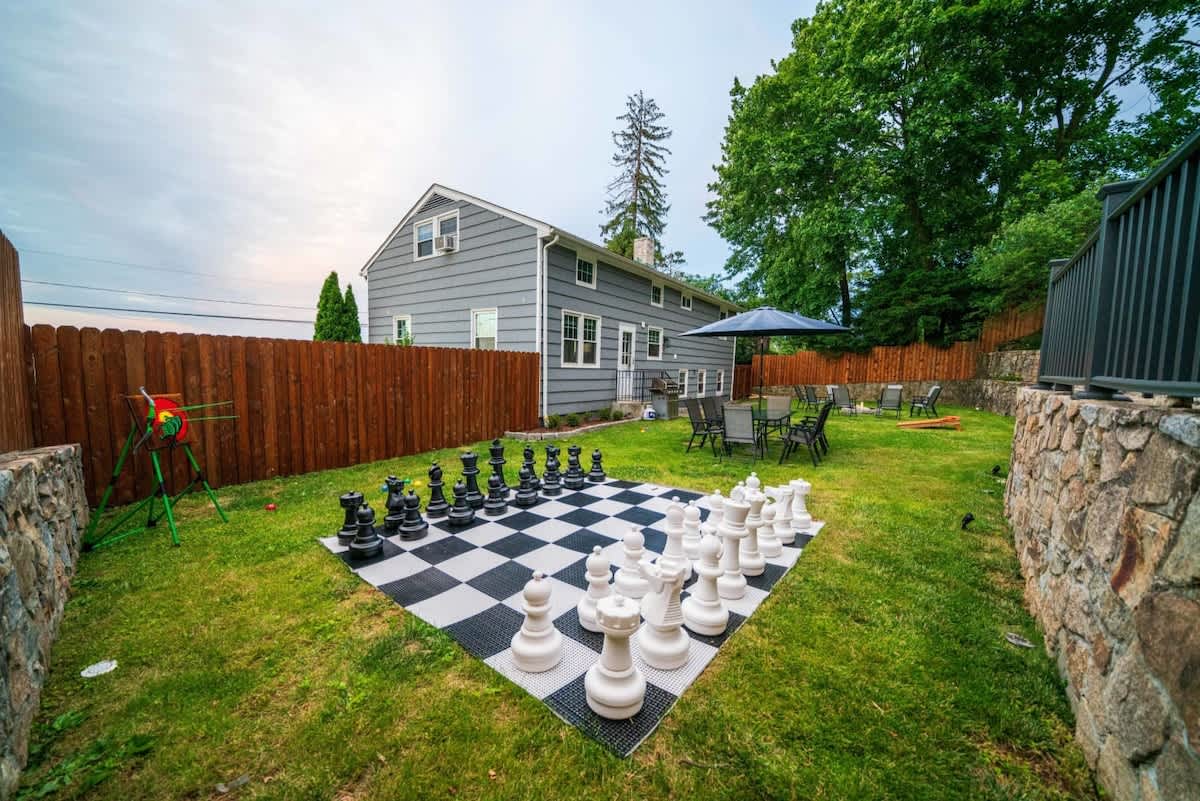 Giant outdoor chess, corn hole, axe throwing/archery games