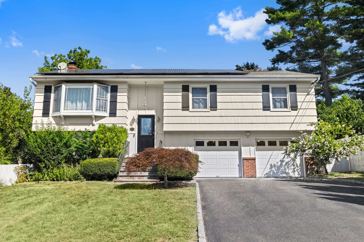 Front of the house. Driveway fits 4 cars. One car can be parked alongside the house.