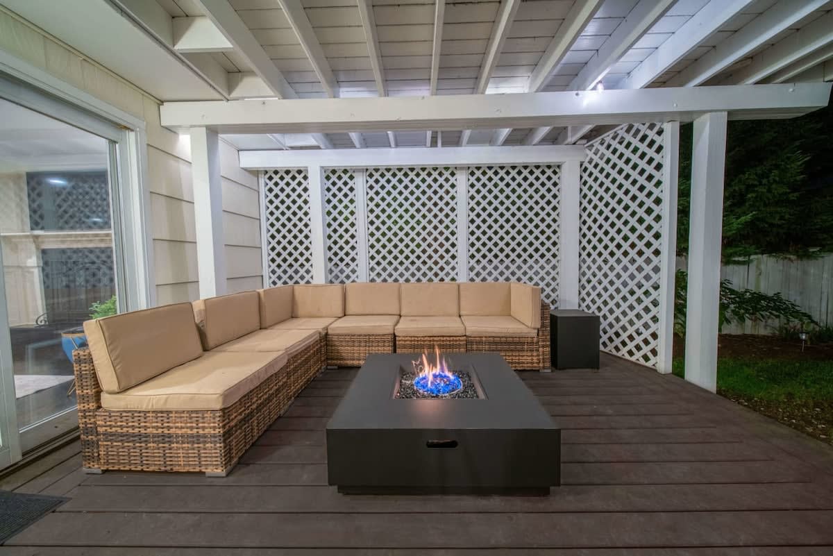 Lower deck area with cozy sectional and gas firepit