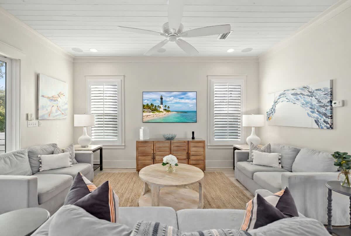 Living room 1:  Sofa seating for a family plus a Smart tv for entertainment with Streaming options