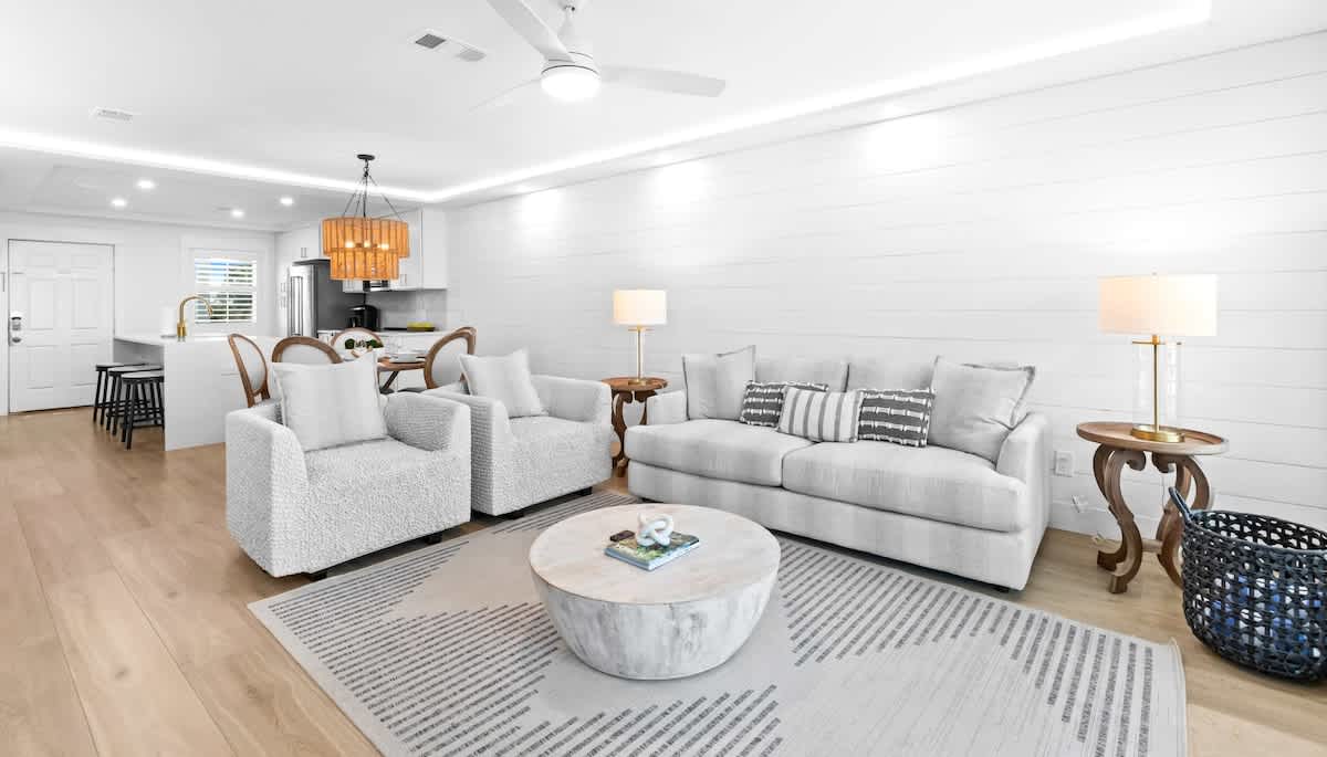 Living room: 65" Smart TV, electric fireplace, beach view, balcony