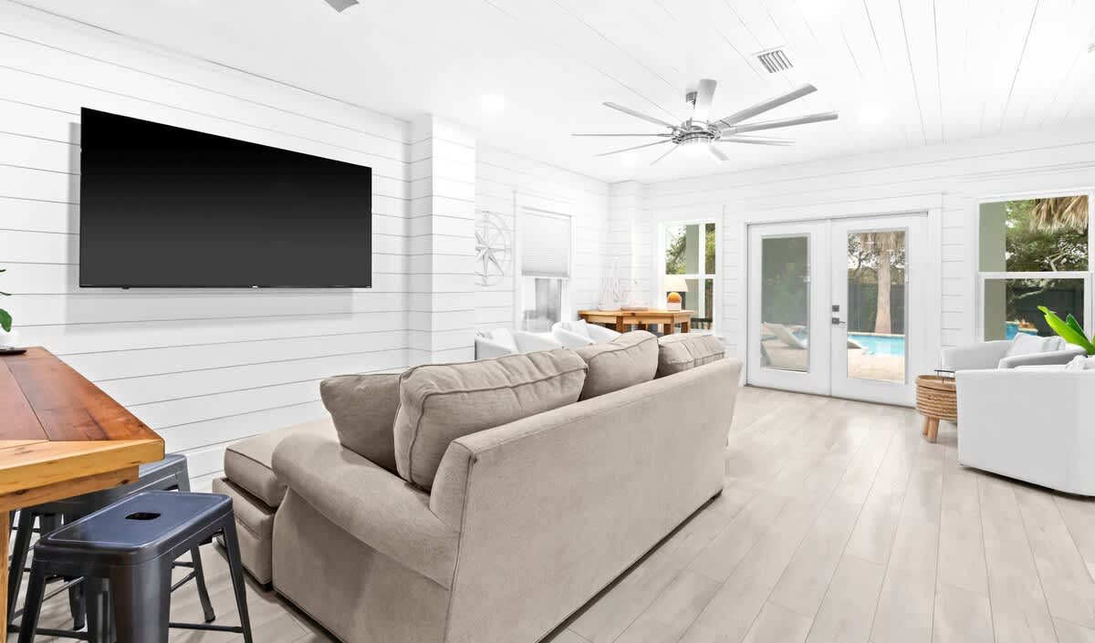 TV room: Smart TV, plush seating, lower floor