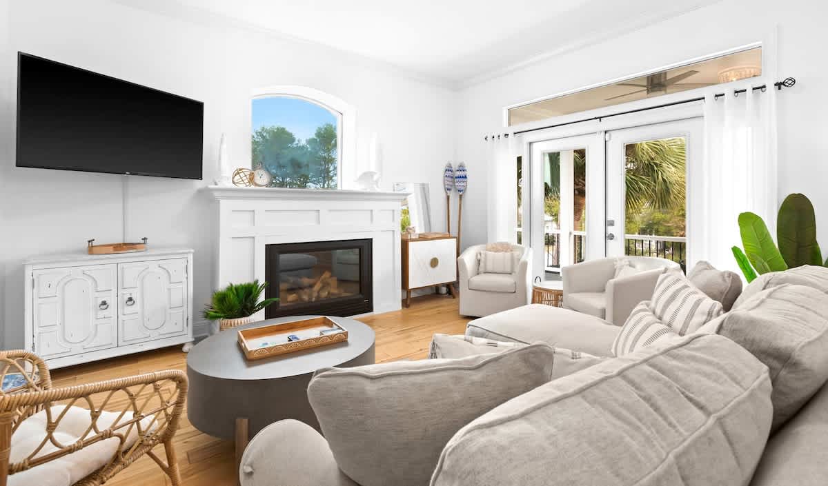 Living room: Smart TV, plush seating, open-concept layout