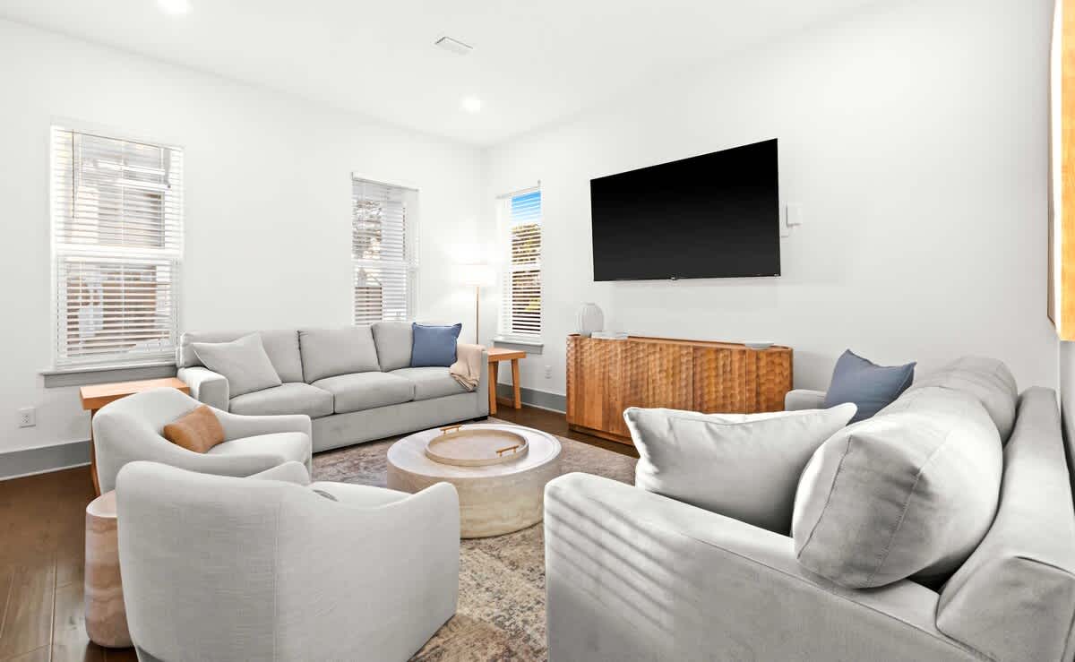 Living Room: Spacious seating area with 75" Smart TV