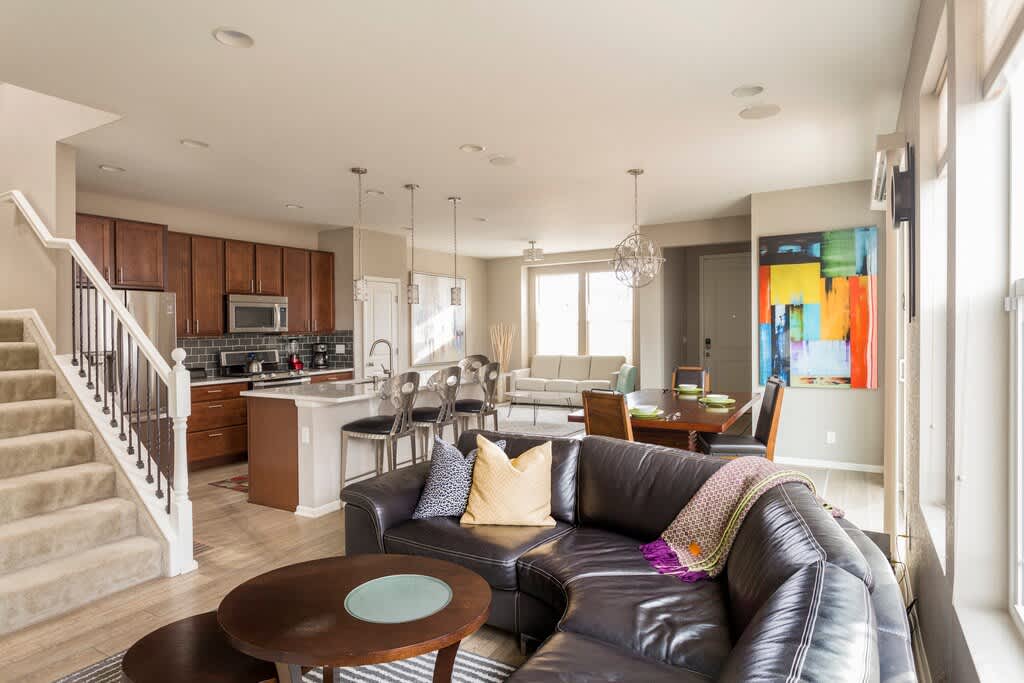 Large sitting area with a beautiful Scandinavian sectional couch. Perfect to sit and and relax and watch a movie with a wine and a surround sound system.