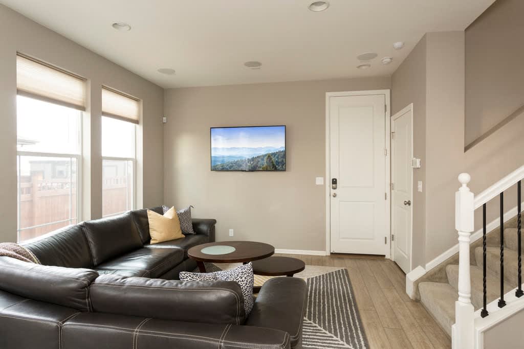 Large sitting area with a beautiful sectional Scandinavian couch. Perfect to sit and and relax and watch a movie with a wine and surrounded sound system.