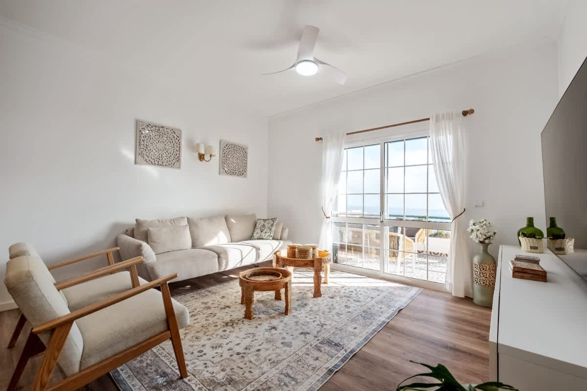 Open living and dining space of the Santa Luzia apartment
