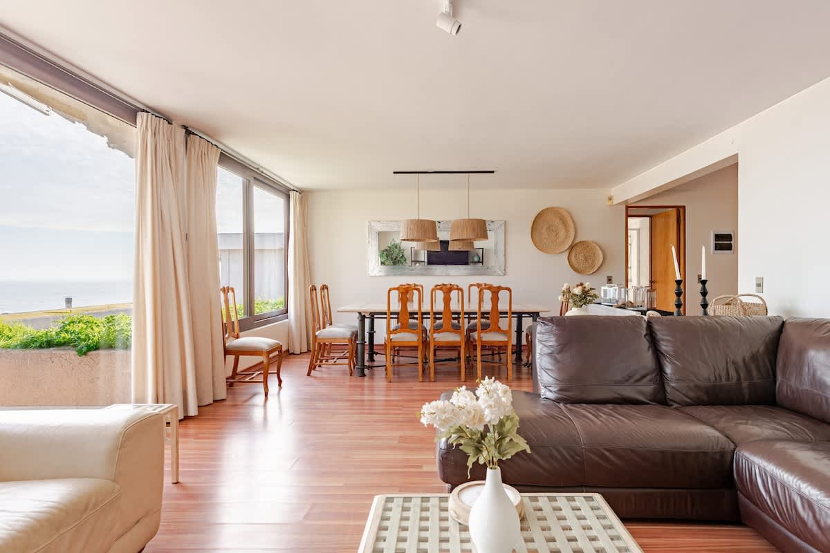 Enjoy stunning ocean views from this spacious living and dining area, perfect for gatherings and relaxation.