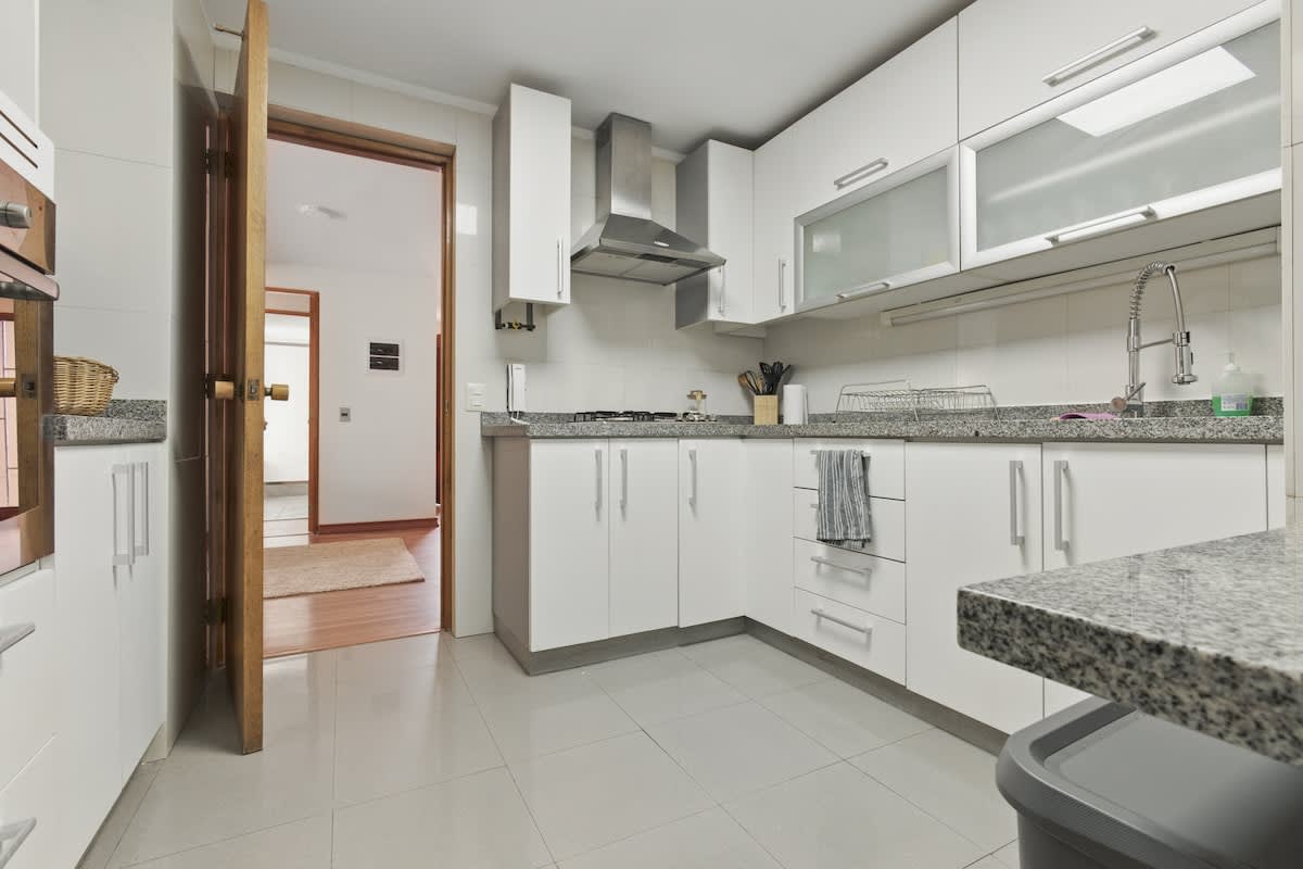 Modern kitchen with sleek design and ample counter space, perfect for preparing meals during your stay.