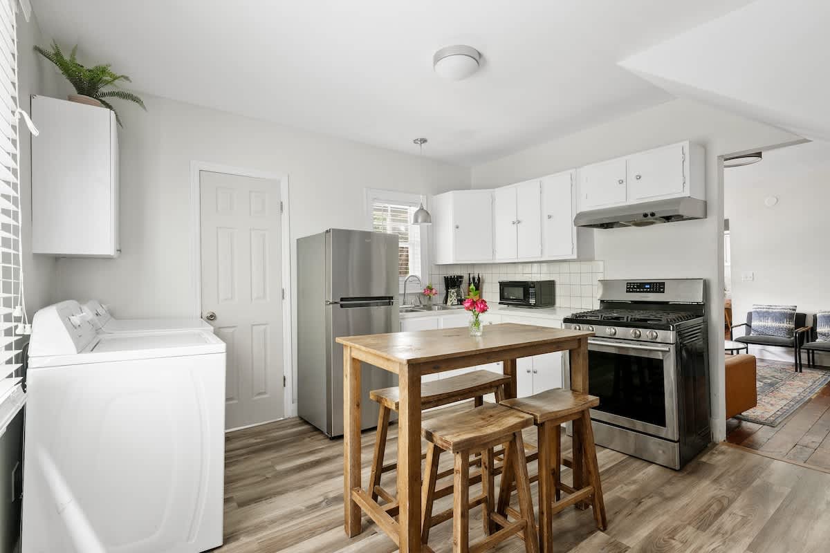 Kitchen with seating for 4 at a bar top table. 