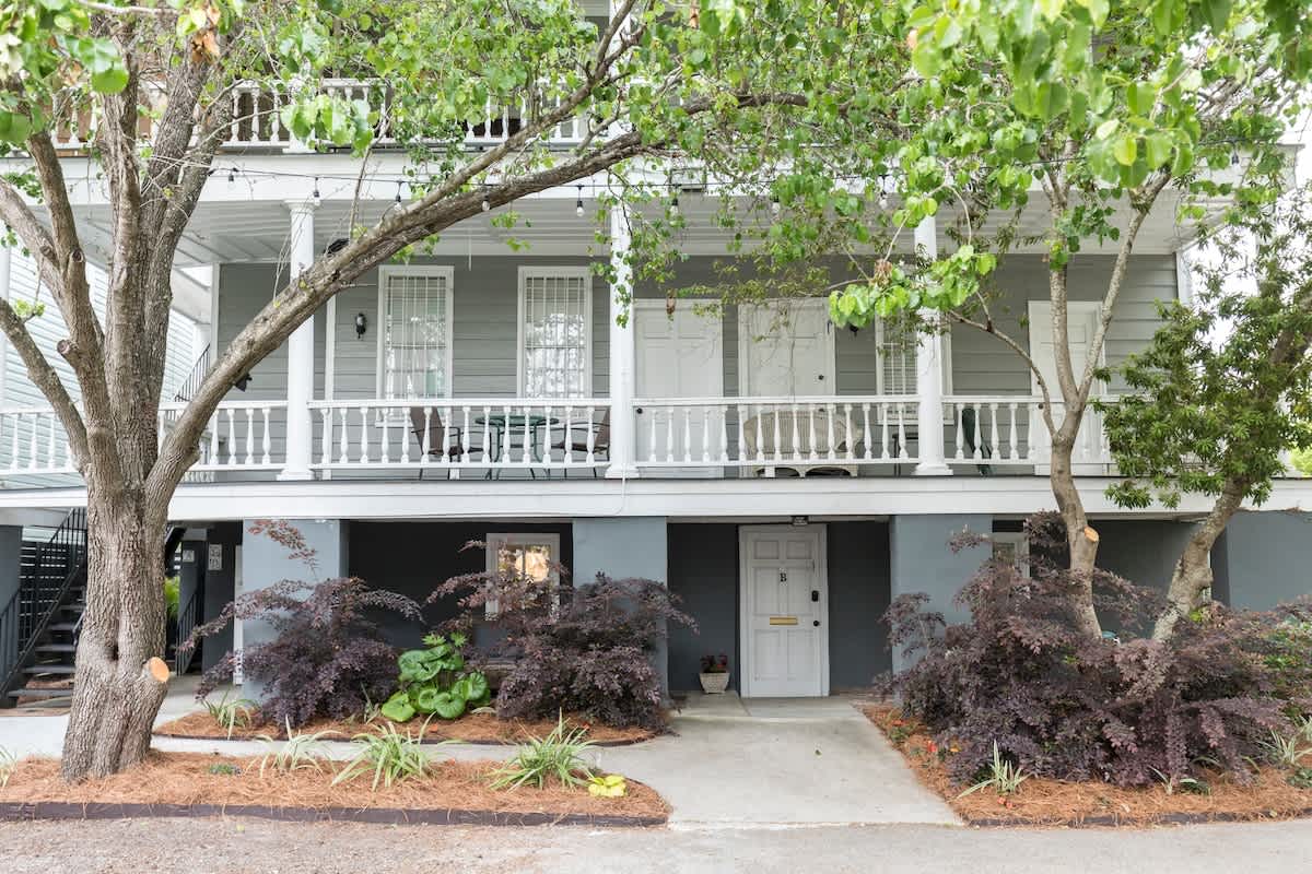 Back of 109 Cannon Street. Taken from private parking area, showing patio and entrance to this apartment on the ground floor. 