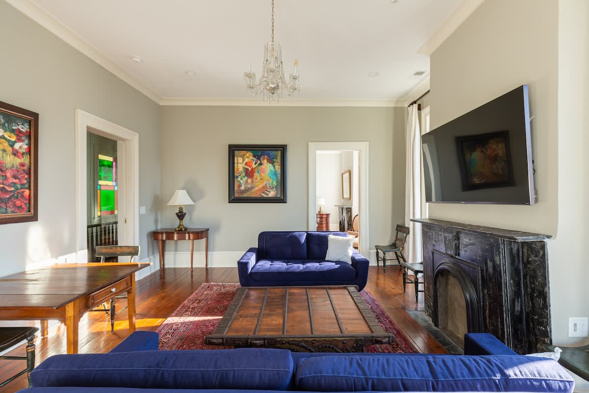 Living Room with Small Dining Table and 65 inch Roku TV