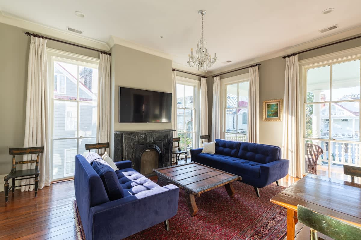 Bright open Living Room with 65" Roku TV and Small Dining Table