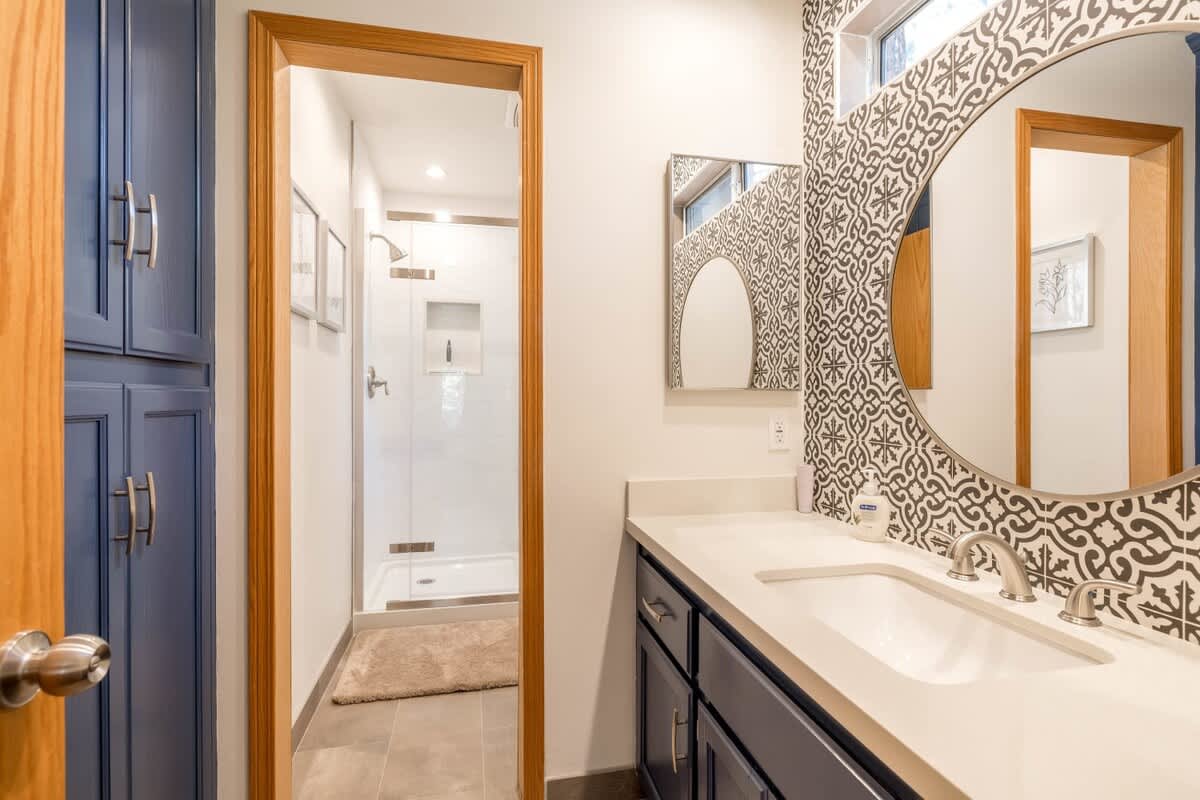 Master Bathroom with cool tiled wall and Subway tile Shower.