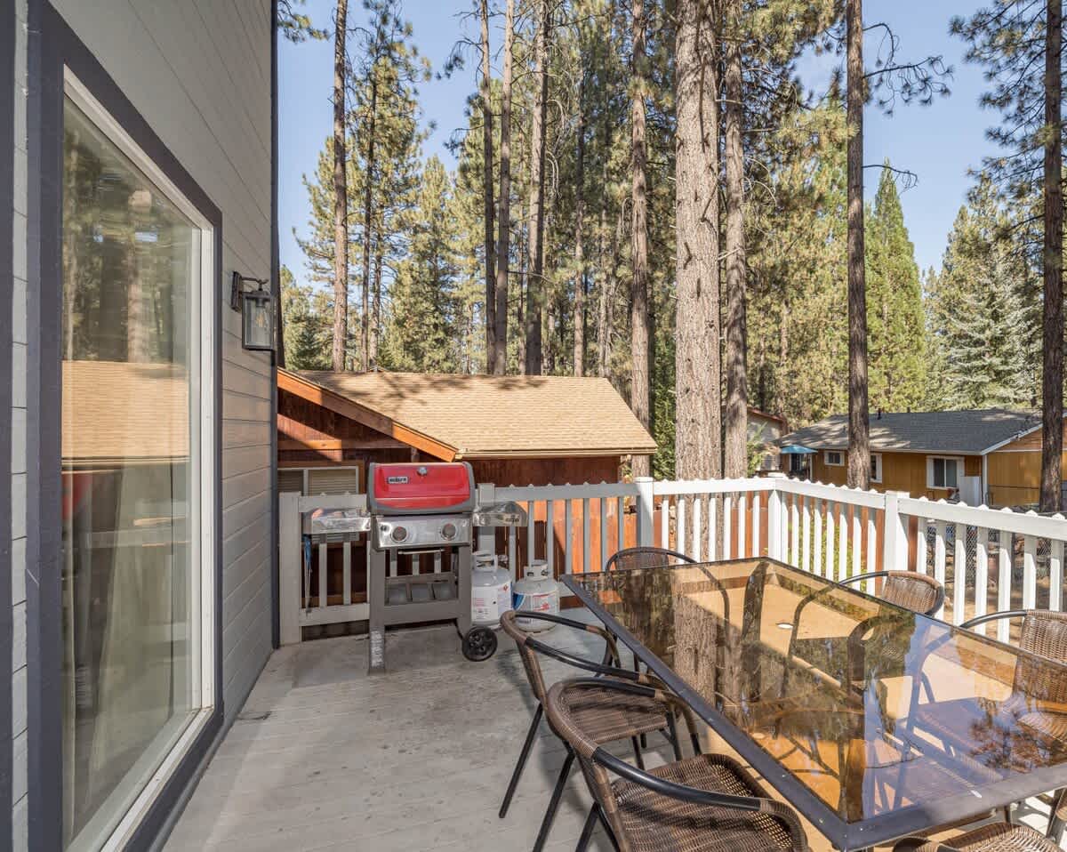 Outside Deck with Weber Grill and outdoor seating under the Pines.