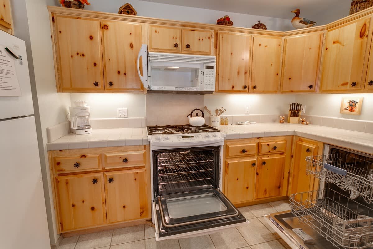 Kitchen with dishwasher and gas range