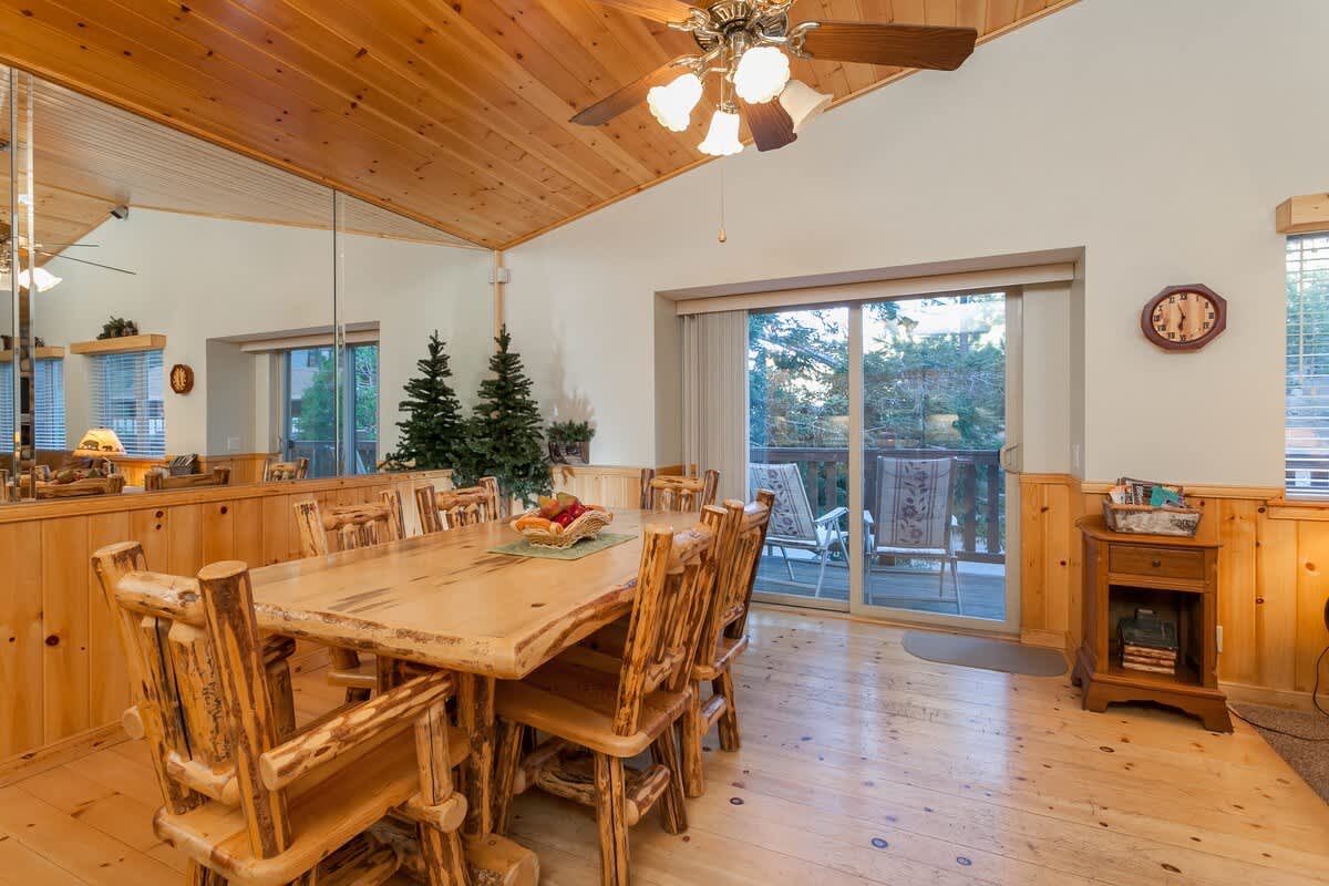 Log dining table with doors to the deck