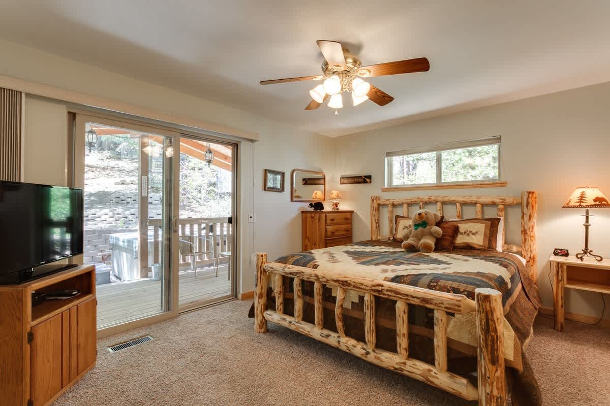 Primary bedroom with doors to the hot tub deck