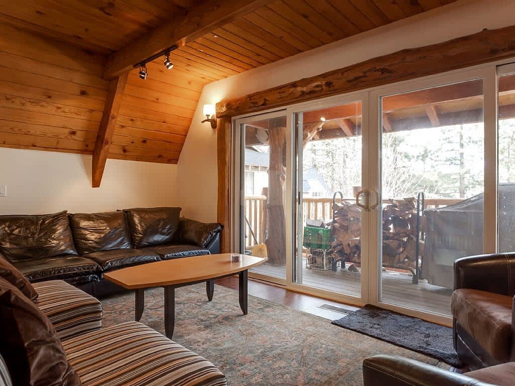 Living room with sliding doors to the deck