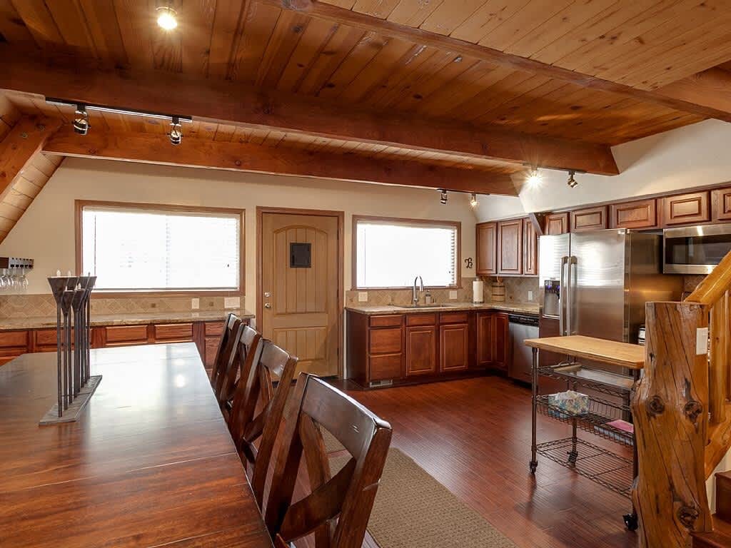 Big dining table next to the kitchen