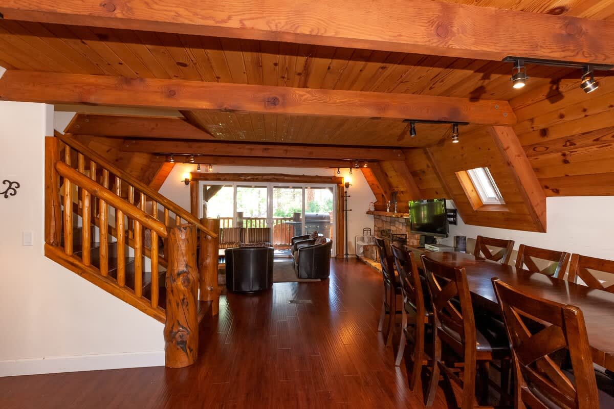 Open main level under wood-beam ceilings