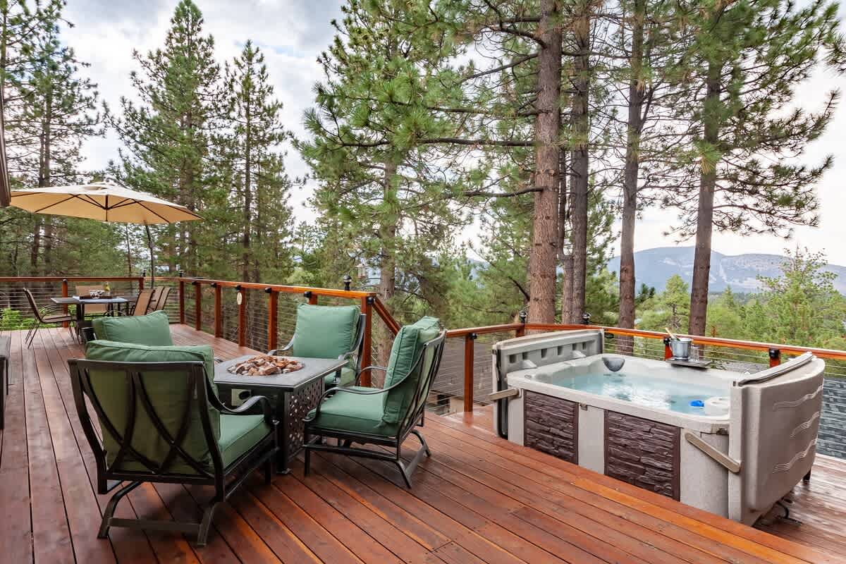 Treetop deck with hot tub and mountain views