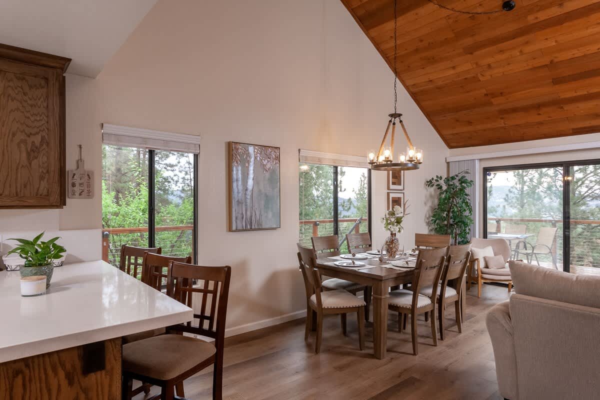 Bright dining area under vaulted ceilings