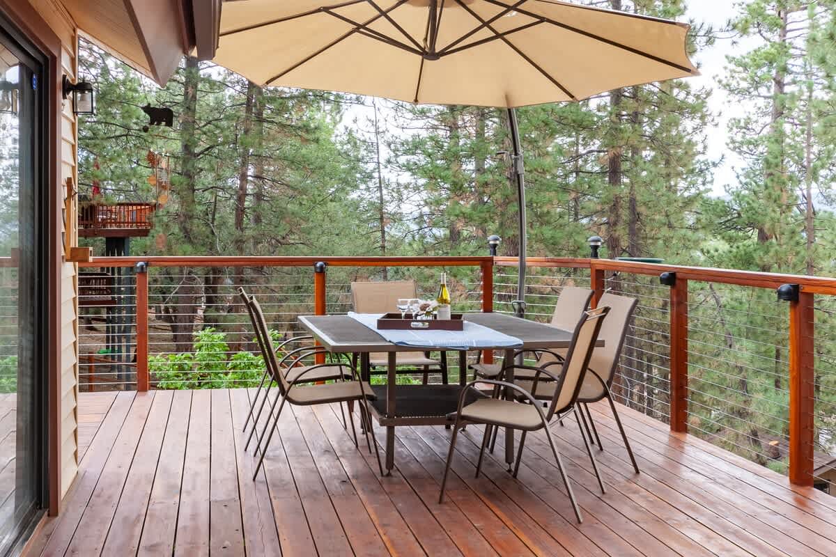 Covered deck dining with mountain views