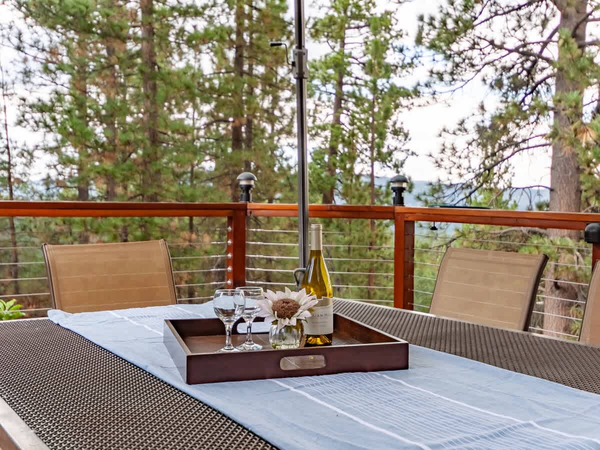 Deck dining with a view of the pines