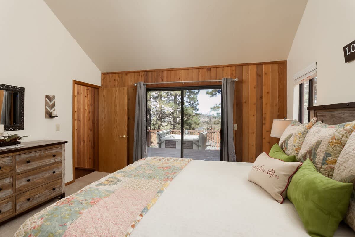 Primary bedroom opens to the hot tub deck