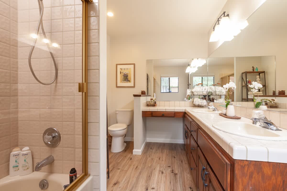 Primary bathroom with double sinks and tub