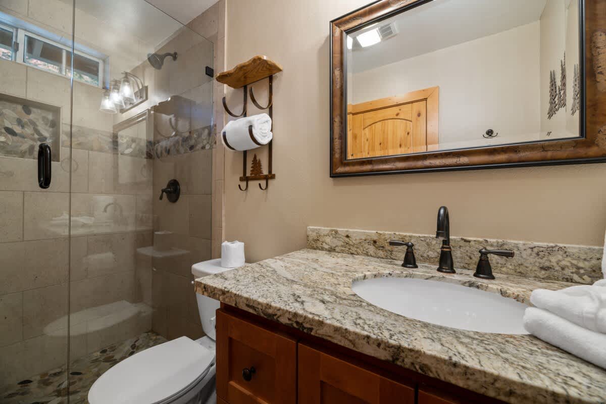 Primary ensuite bathroom with glass shower