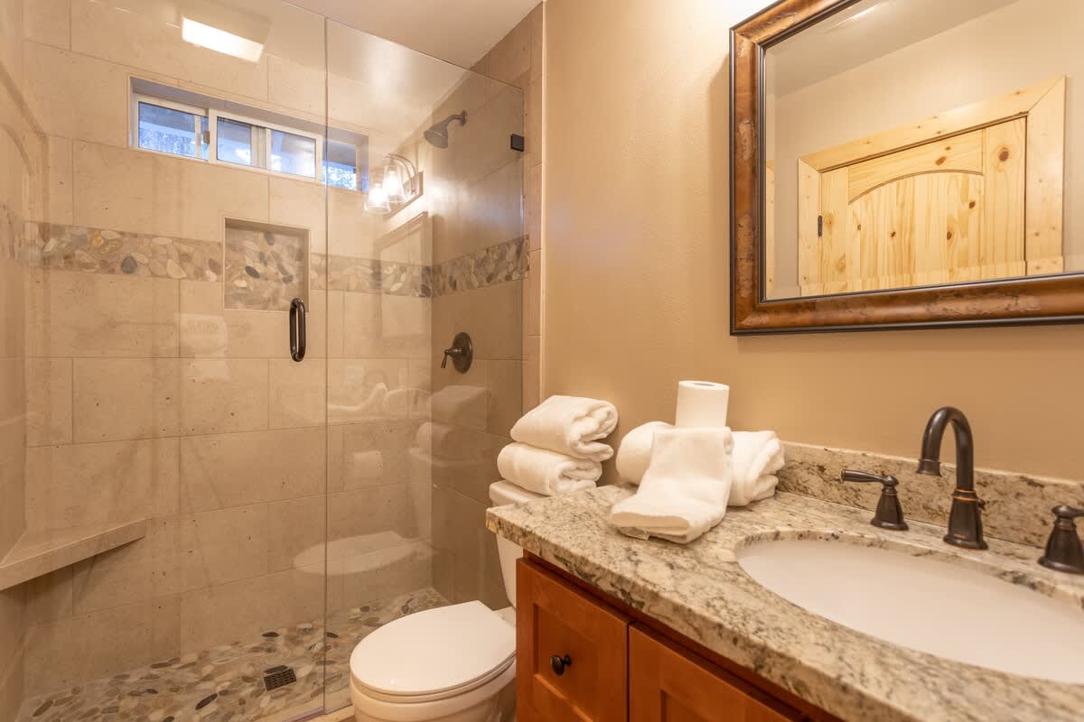 Hallway bathroom with glass shower