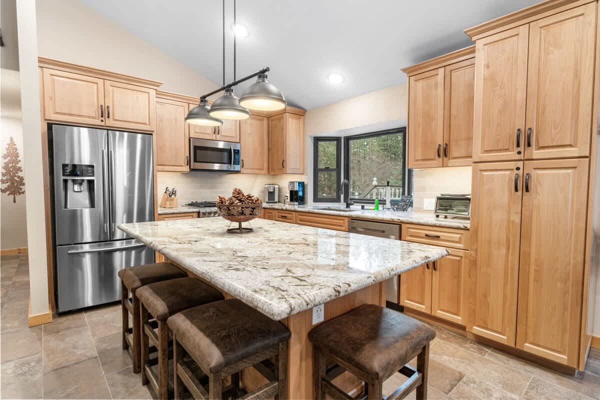 New kitchen with granite island seating