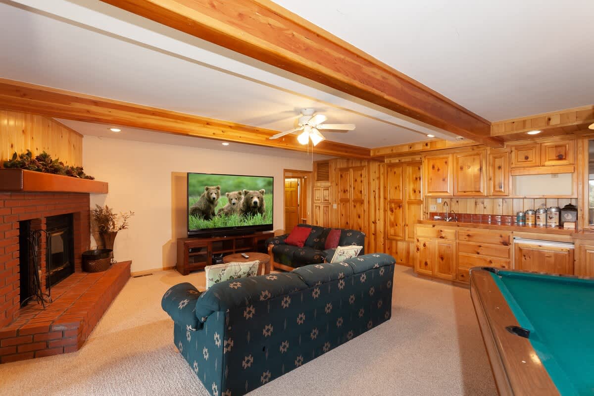 Game room with pool table and big TV