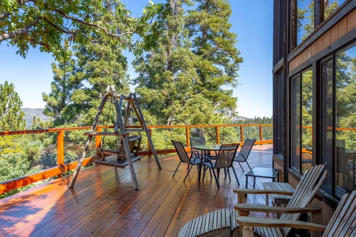 Wrap-around deck with swing and seating